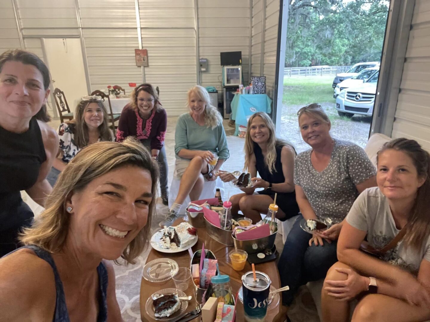 A group of people sitting around a table.