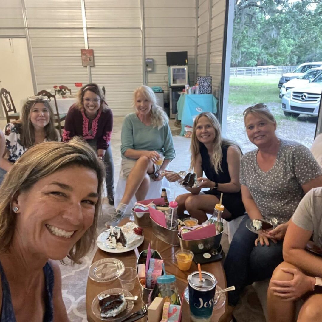 A group of people sitting around a table.